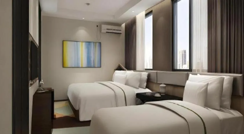 Bed in IU Hotel Qingdao Golden Beach Xuejiadao Metro Station