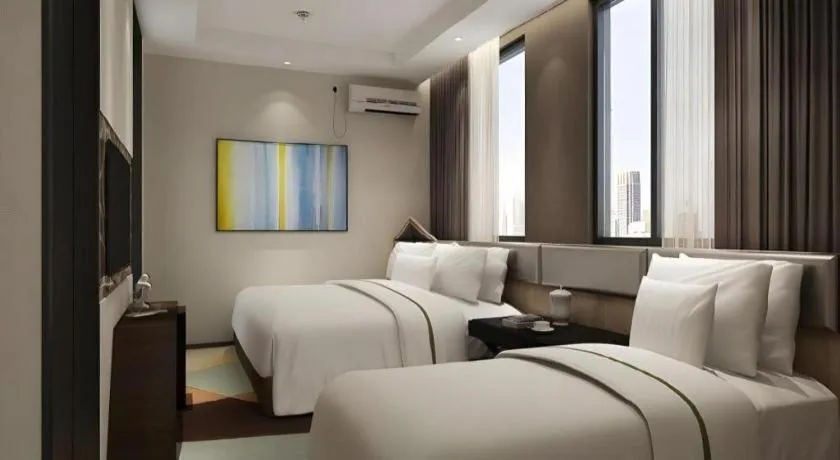 Bed in IU Hotel Qingdao Golden Beach Xuejiadao Metro Station