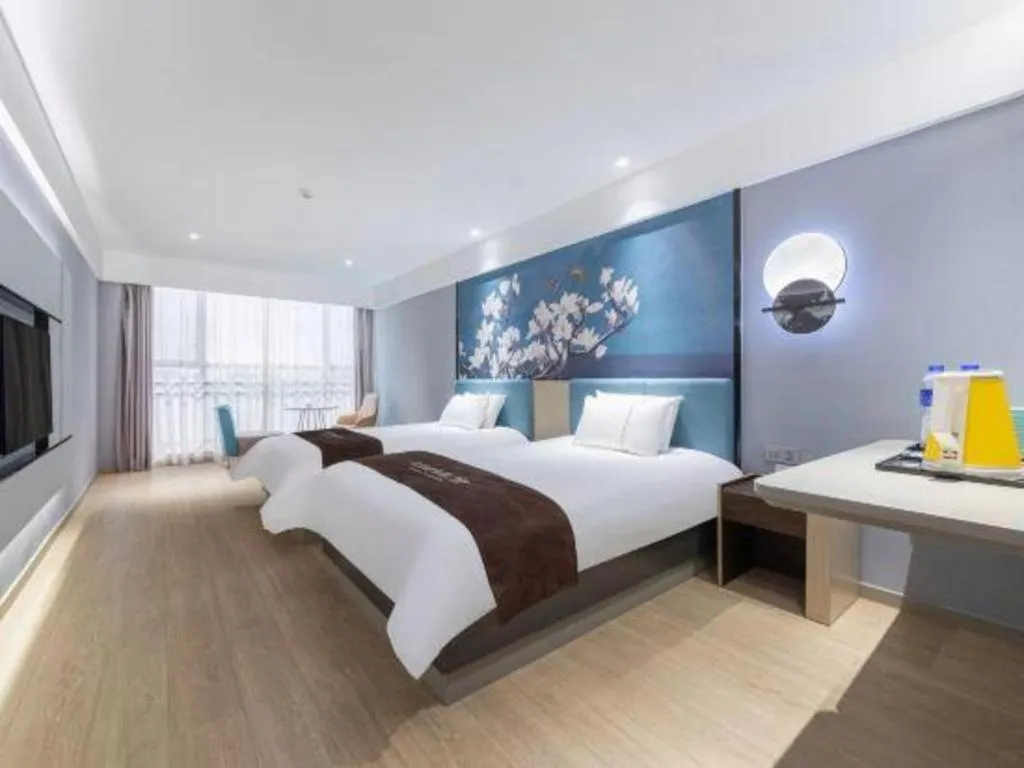 Bed in Magnotel Hotel Anshun West High-Speed Railway Station