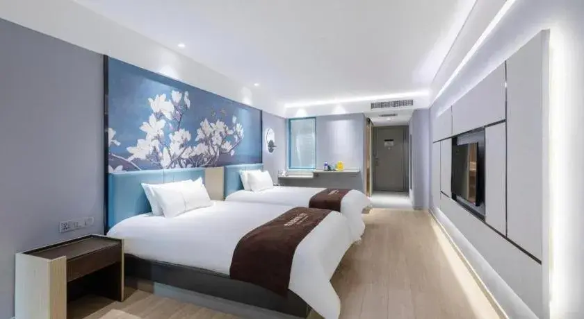 Bed in Magnotel Hotel Anshun West High-Speed Railway Station Bed in Magnotel Hotel Anshun West High-Speed Railway Station