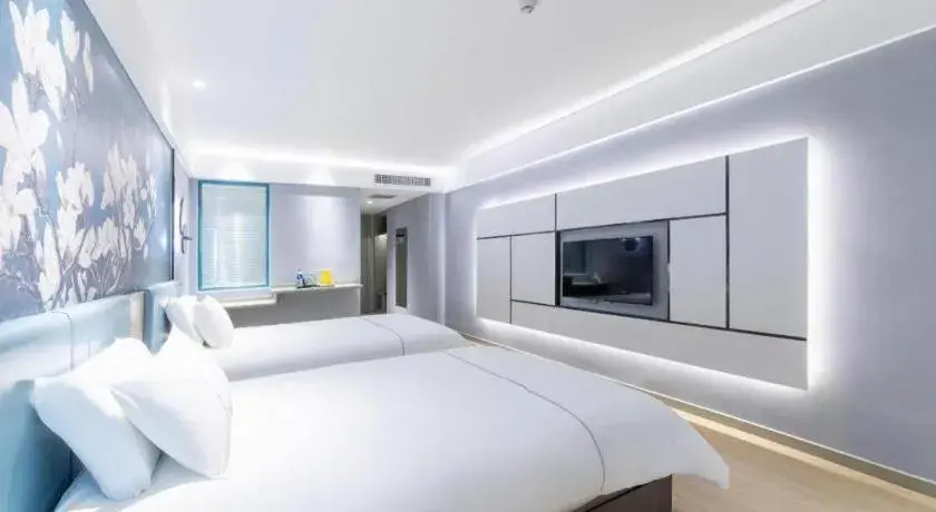 Bed in Magnotel Hotel Anshun West High-Speed Railway Station Bed in Magnotel Hotel Anshun West High-Speed Railway Station