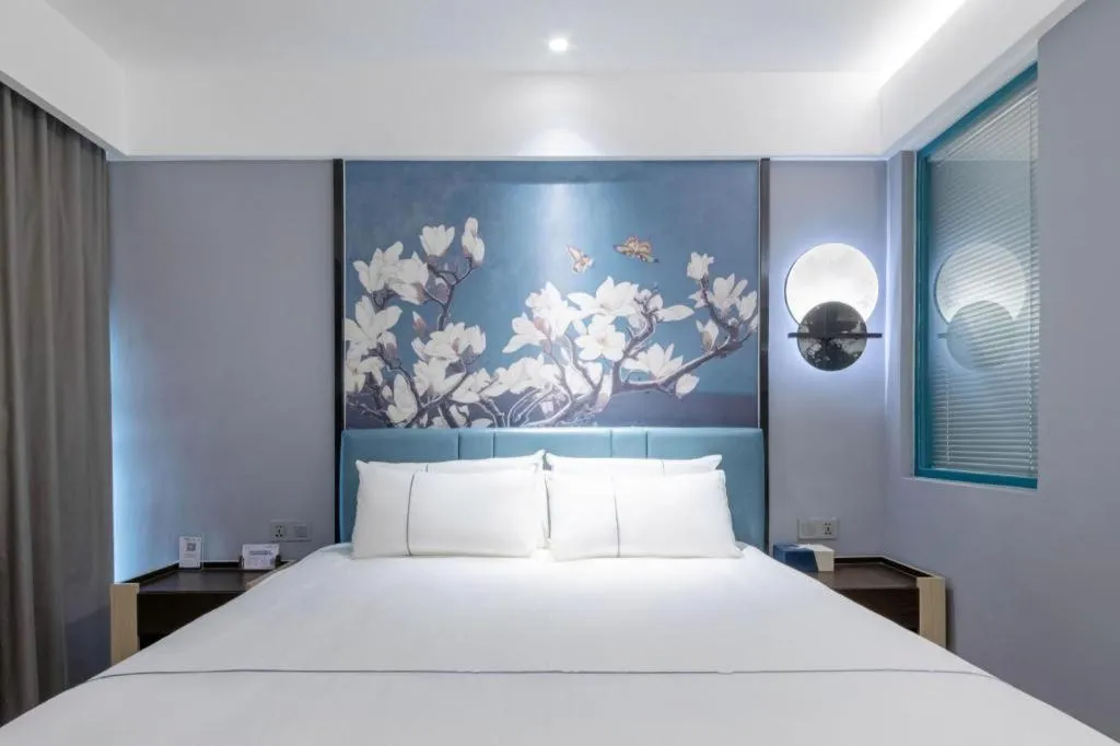 Bed in Magnotel Hotel Anshun West High-Speed Railway Station