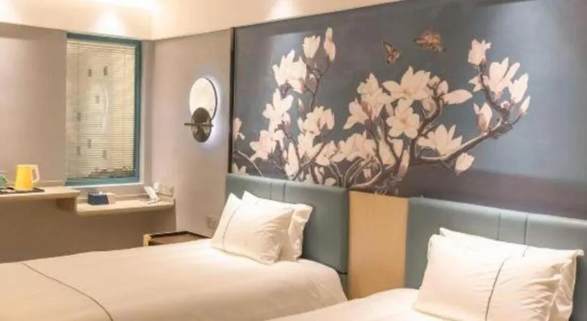 Bed in Magnotel Hotel Anshun West High-Speed Railway Station