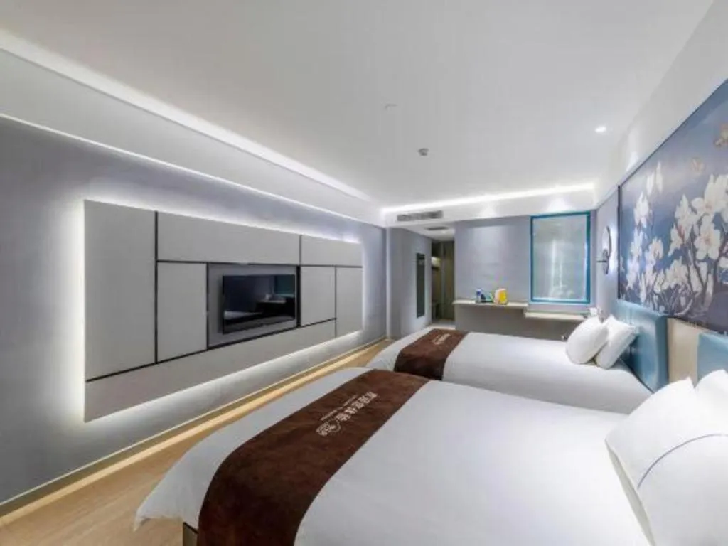 Bed in Magnotel Hotel Anshun West High-Speed Railway Station