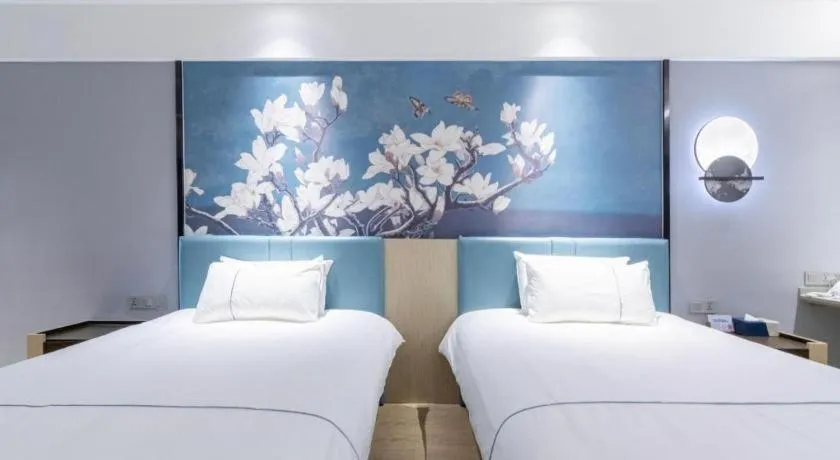 Bed in Magnotel Hotel Anshun West High-Speed Railway Station