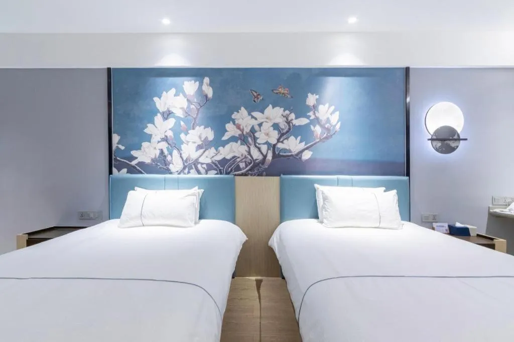 Bed in Magnotel Hotel Anshun West High-Speed Railway Station