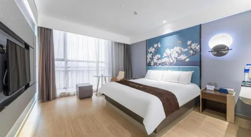 Bed in Magnotel Hotel Anshun West High-Speed Railway Station Bed in Magnotel Hotel Anshun West High-Speed Railway Station