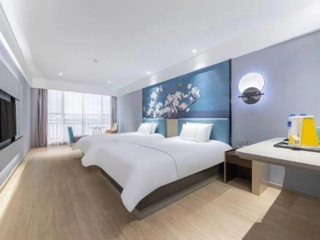 Bed in Magnotel Hotel Anshun West High-Speed Railway Station