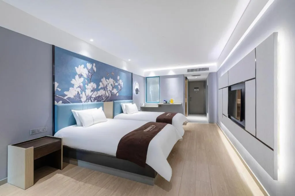Bed in Magnotel Hotel Anshun West High-Speed Railway Station
