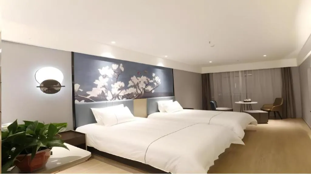 Bed in Magnotel Hotel Anshun West High-Speed Railway Station