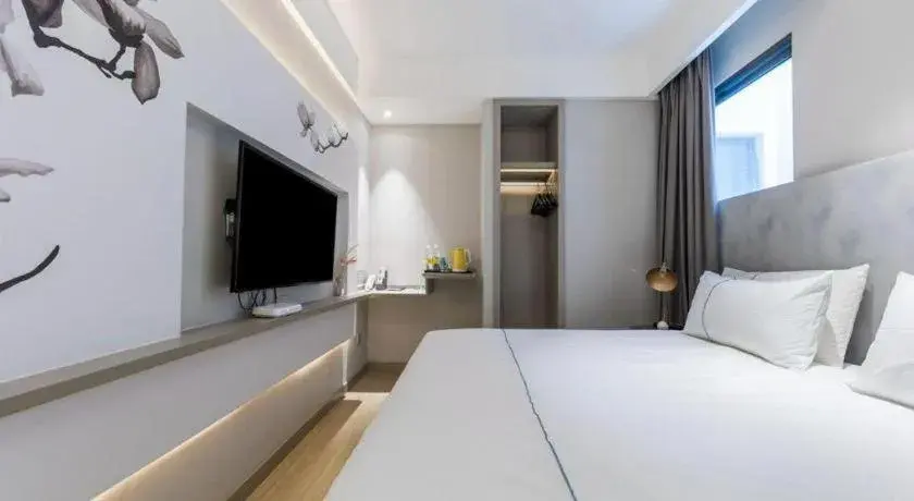 Bed in Magnotel Hotel Suzhou Guanqian Street Pingjiang Road Bed in Magnotel Hotel Suzhou Guanqian Street Pingjiang Road