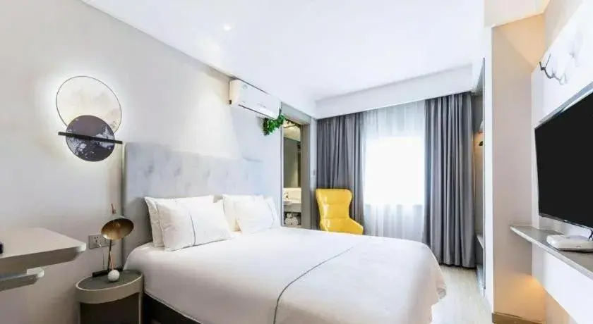 Bed in Magnotel Hotel Suzhou Guanqian Street Pingjiang Road Bed in Magnotel Hotel Suzhou Guanqian Street Pingjiang Road