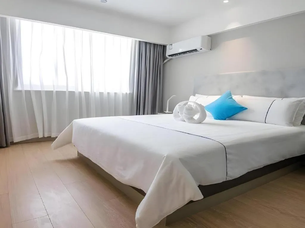 Bed in Magnotel Hotel Suzhou Guanqian Street Pingjiang Road