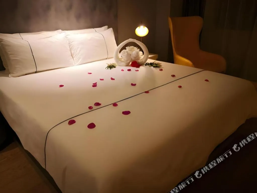 Bed in Magnotel Hotel Suzhou Guanqian Street Pingjiang Road