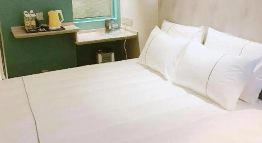 Bed in Magnotel Hotel Suzhou Guanqian Street Pingjiang Road