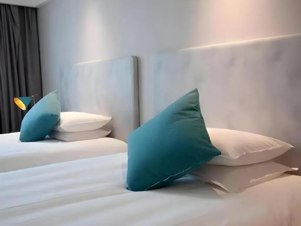 Bed in Magnotel Hotel Suzhou Guanqian Street Pingjiang Road