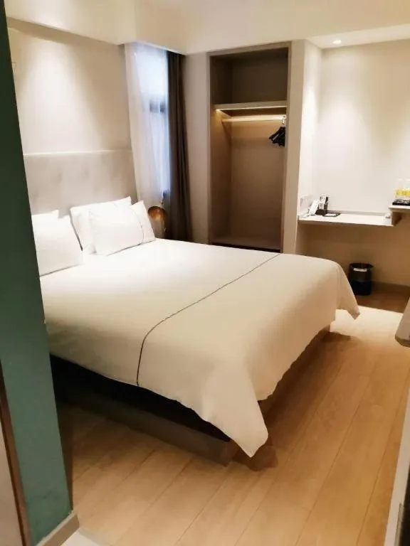 Bed in Magnotel Hotel Suzhou Guanqian Street Pingjiang Road