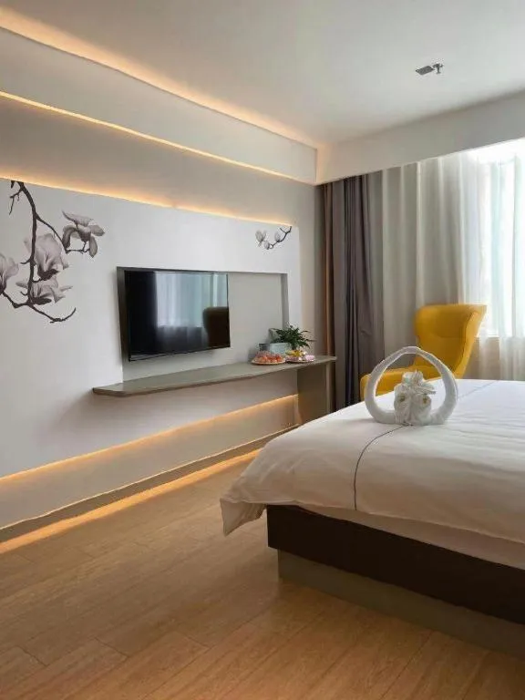 Bed in Magnotel Hotel Jining Yanzhou Metro Station Jiuxianqiao South Road