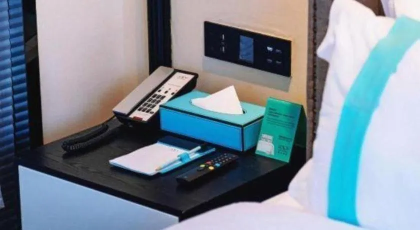 Bed in Xana Hotelle Chengdou Xindu Sanhechang Metro Station