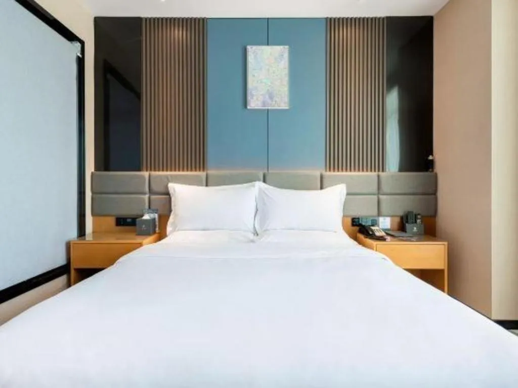 Bed in Chonpines Hotel Guangzhou Sunac Cultural and Tourism City Shiling
