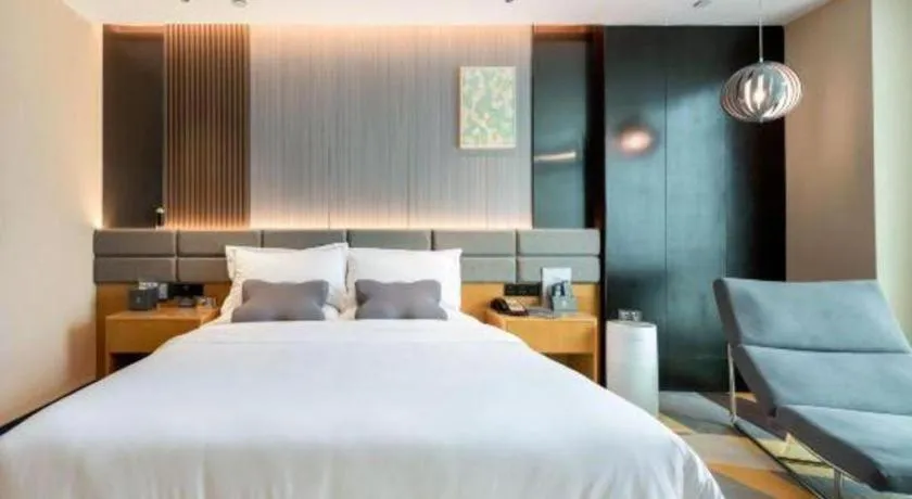 Bed in Chonpines Hotel Guangzhou Sunac Cultural and Tourism City Shiling