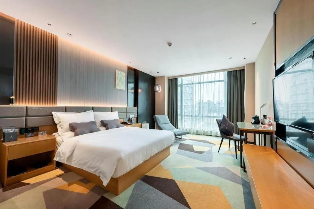 Bed in Chonpines Hotel Guangzhou Sunac Cultural and Tourism City Shiling
