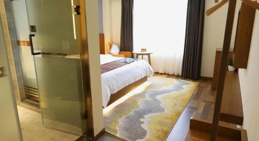 Bed in James Joyce Coffetel Guangyuan High-Speed Railway Station Dongba Municipal Government