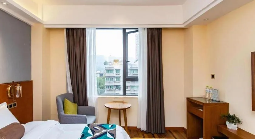 Bed in James Joyce Coffetel Guangyuan High-Speed Railway Station Dongba Municipal Government