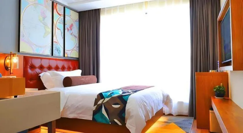 Bed in James Joyce Coffetel Guangyuan High-Speed Railway Station Dongba Municipal Government