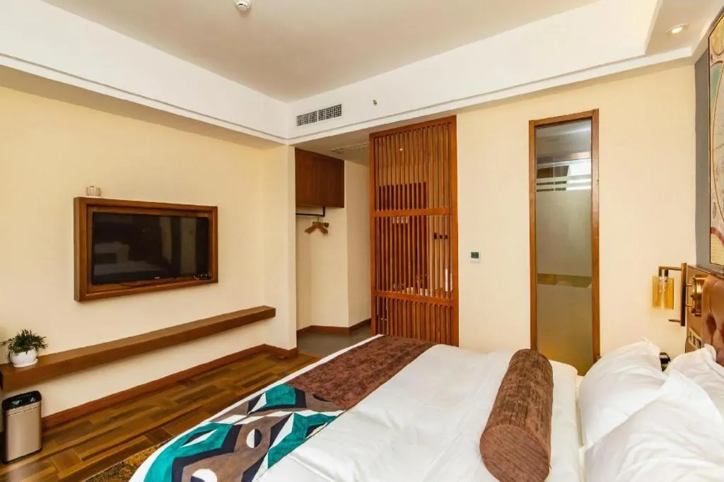 Bed in James Joyce Coffetel Guangyuan High-Speed Railway Station Dongba Municipal Government