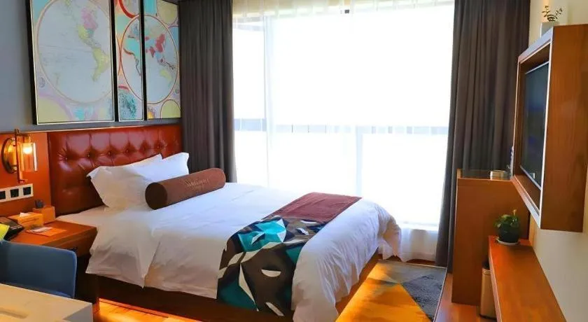 Bed in James Joyce Coffetel Guangyuan High-Speed Railway Station Dongba Municipal Government