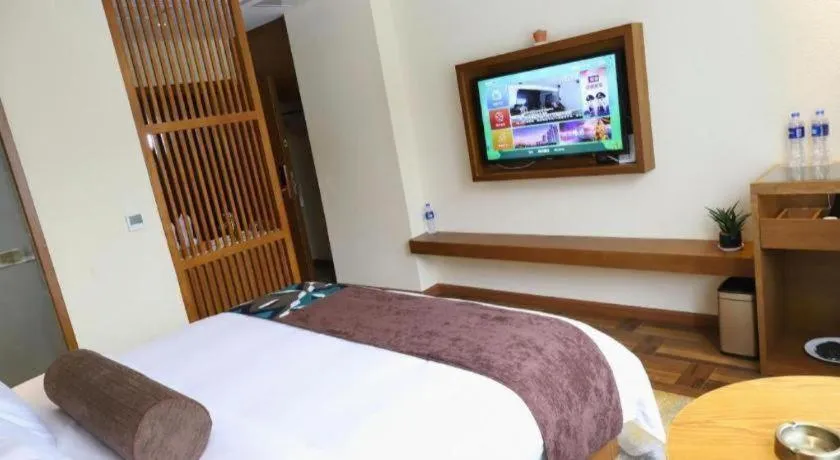 Bed in James Joyce Coffetel Guangyuan High-Speed Railway Station Dongba Municipal Government