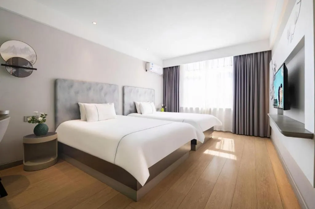 Bed in Magnotel Hotel Dandong Railway Yalv River