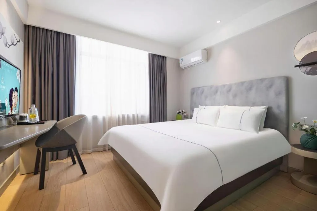 Bed in Magnotel Hotel Dandong Railway Yalv River