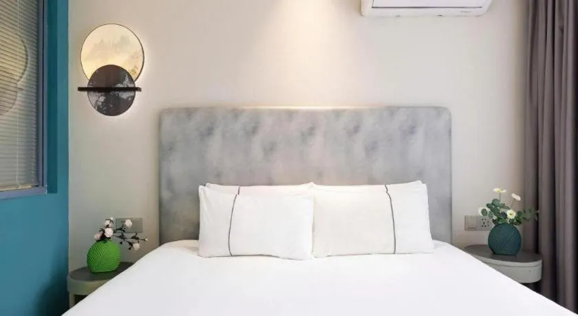 Bed in Magnotel Hotel Dandong Railway Yalv River