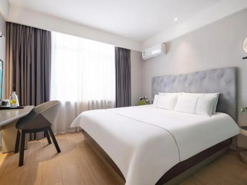 Bed in Magnotel Hotel Dandong Railway Yalv River