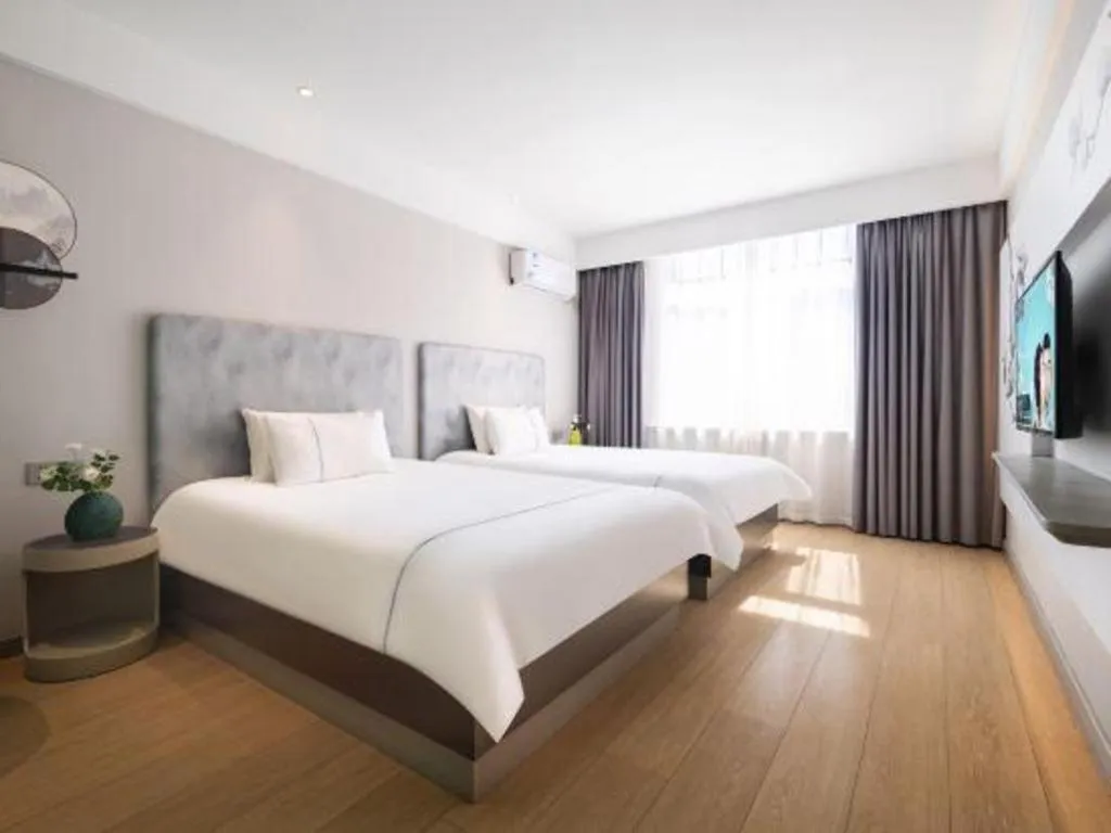 Bed in Magnotel Hotel Dandong Railway Yalv River