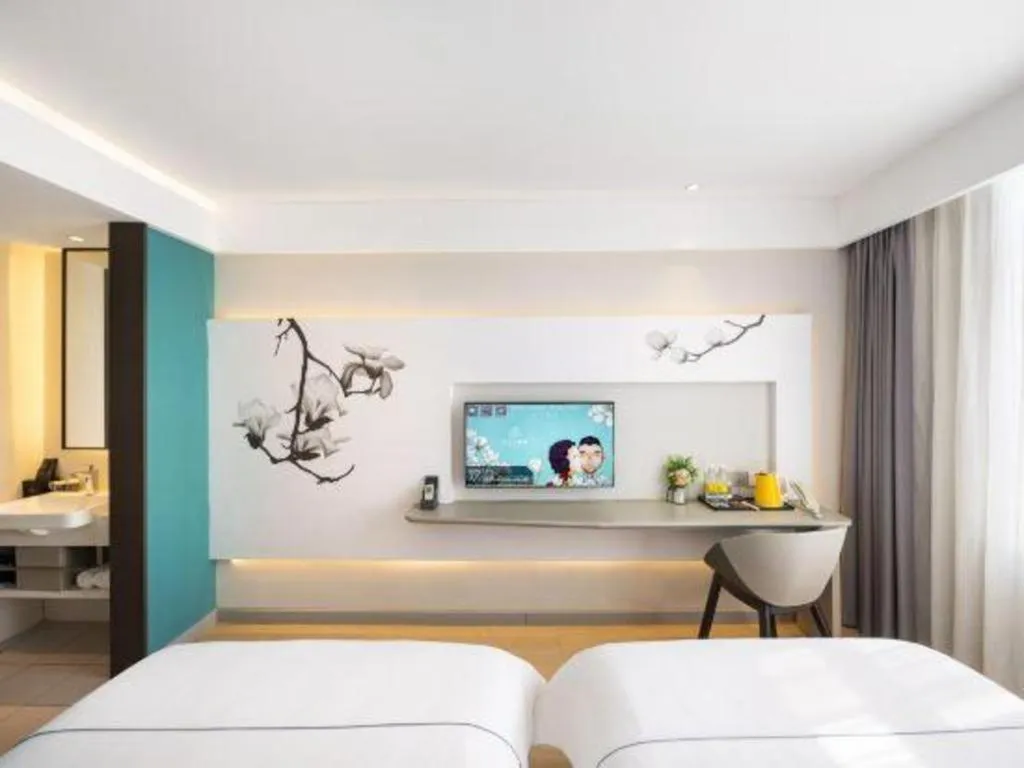 Bed in Magnotel Hotel Dandong Railway Yalv River