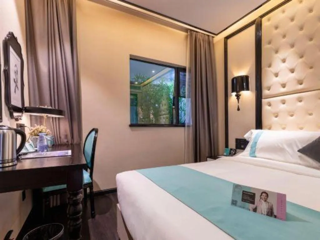 Bed in Xana Hotelle·Guangzhou Shangxiajiu Yongqingfang Changshou Road Metro Station