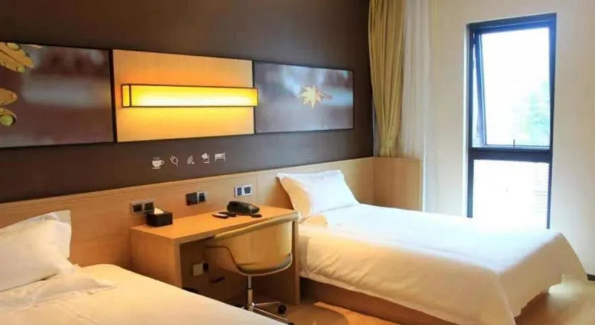 Bed in IU Hotel·Tianjin Binhai New District Yanghuo Market