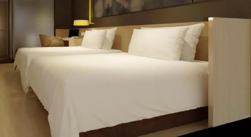 Bed in IU Hotel·Tianjin Binhai New District Yanghuo Market