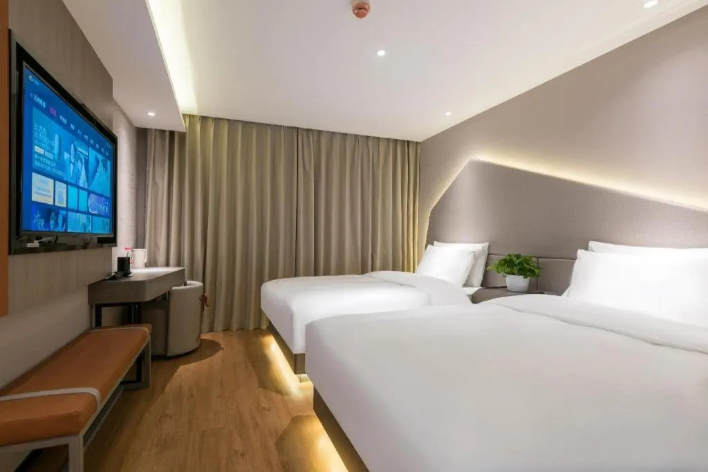 Bed in Zmax Hotel Beijing Wangjing Jiuxianqiao Xingji Bear