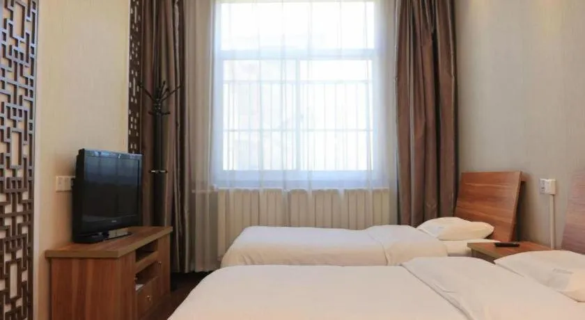 Bed in PAI Hotel Huayin Huashan Mountain Scenic Spot Ancient Street