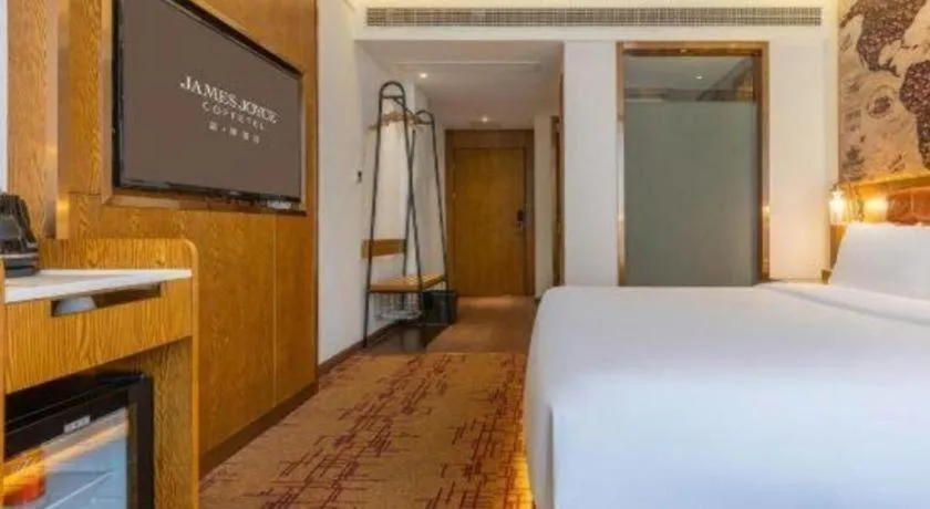 Bed in James Joyce Coffetel·Chadianzi Passenger Terminal Jinke Bei Road Metro Station