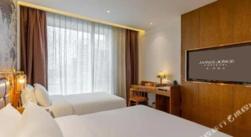 Bed in James Joyce Coffetel·Chadianzi Passenger Terminal Jinke Bei Road Metro Station