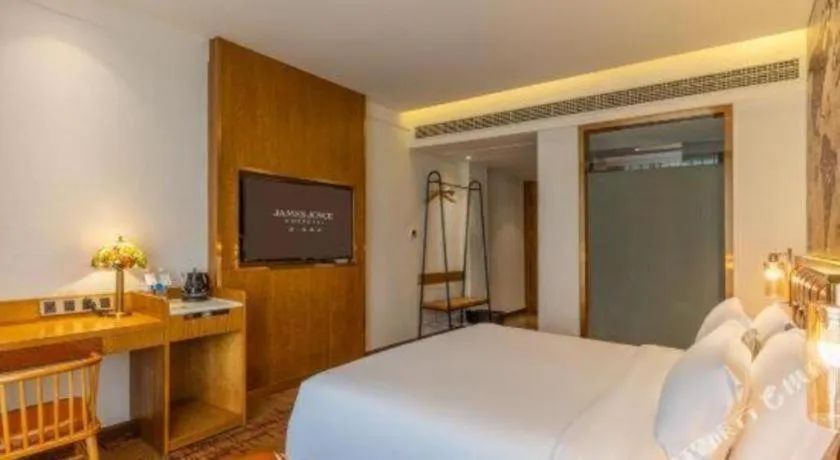 Bed in James Joyce Coffetel·Chadianzi Passenger Terminal Jinke Bei Road Metro Station