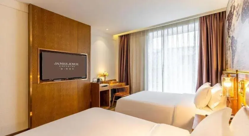 Bed in James Joyce Coffetel·Chadianzi Passenger Terminal Jinke Bei Road Metro Station Bed in James Joyce Coffetel·Chadianzi Passenger Terminal Jinke Bei Road Metro Station