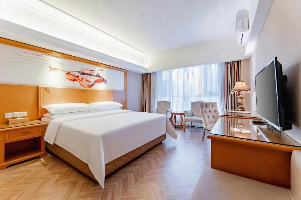 Bed in Vienna Hotel Inner Mongolia Hohhot Railway Station Gongzhufu Metro Station