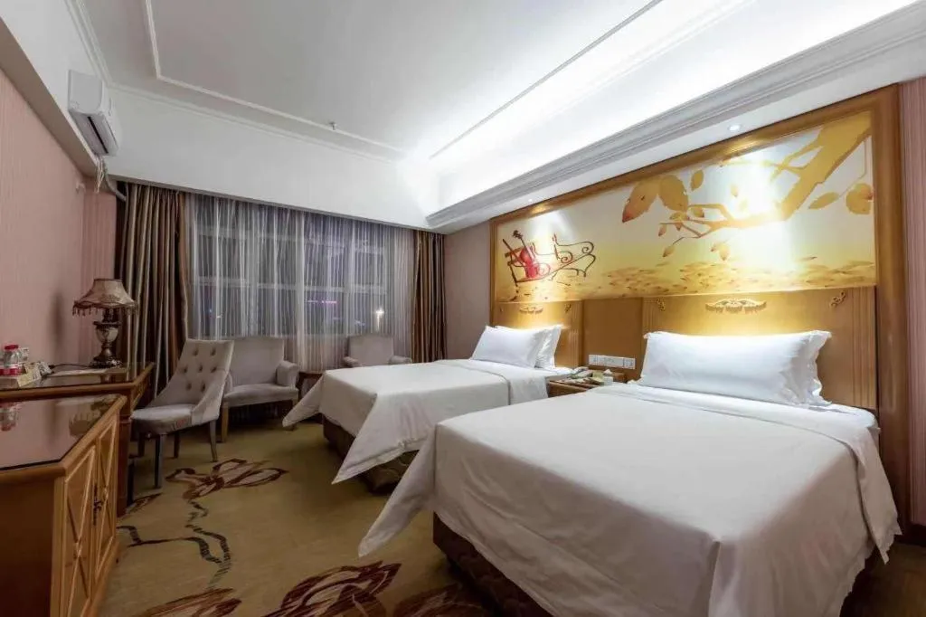 Bed in Vienna Hotel Inner Mongolia Hohhot Railway Station Gongzhufu Metro Station
