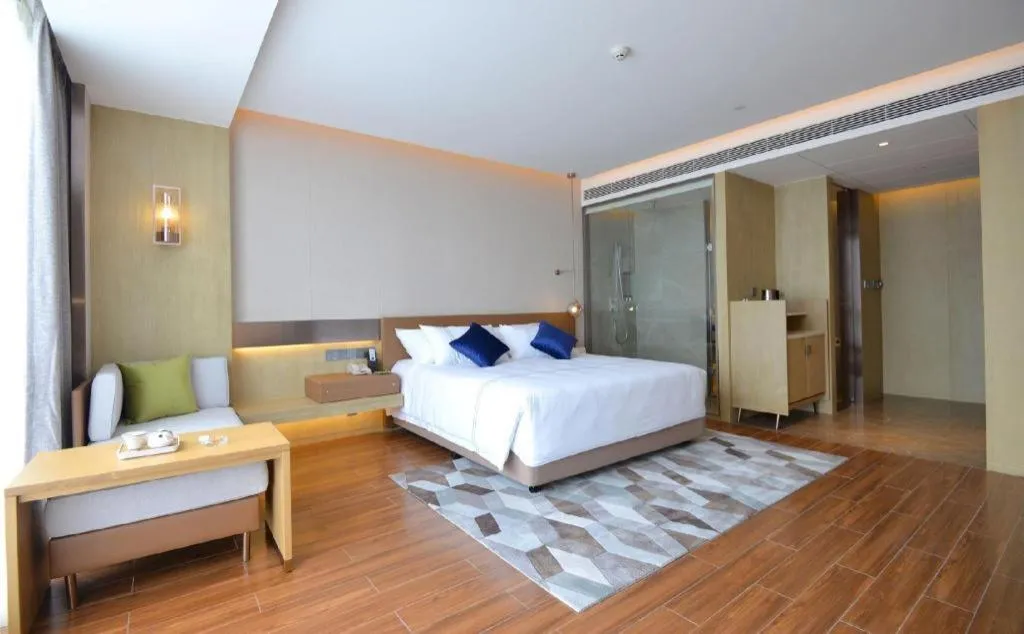 Bed in AUGUSTINE HOTEL